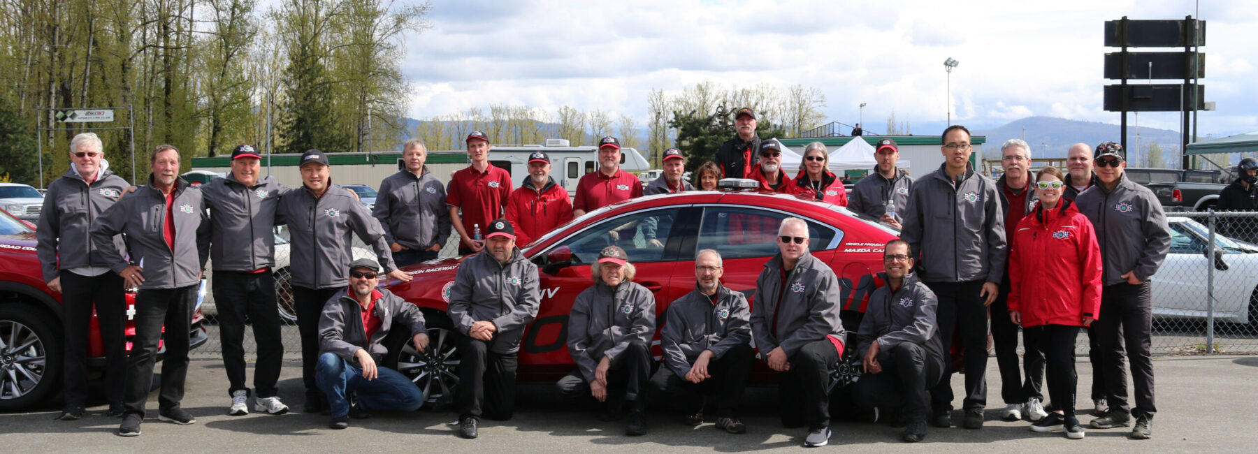 SCCBC source photo of people gathered around a race car