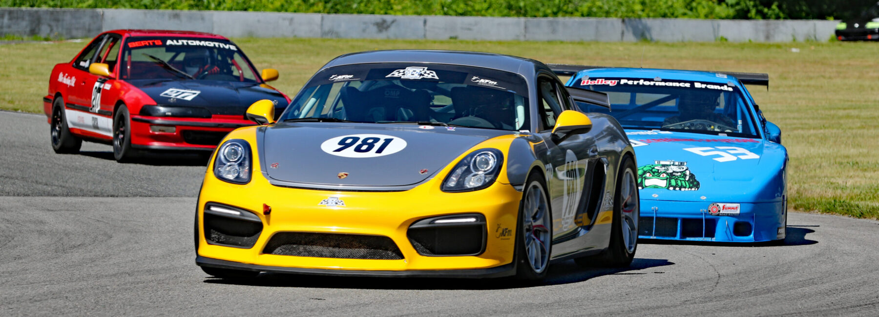 Race cars on the road course at Mission Raceway Park